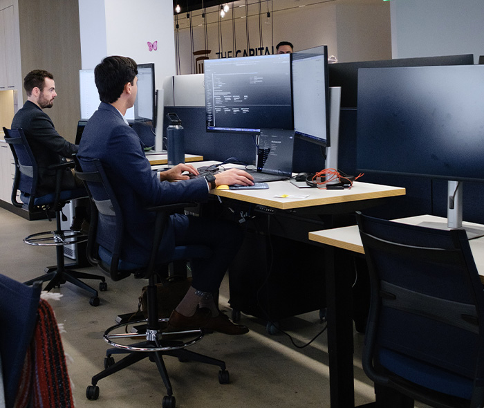 Boat Accidents team members at their desks