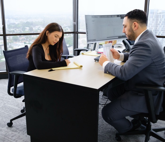 Candid photo of lawyer and client Comprehensive Personal Injury Representation