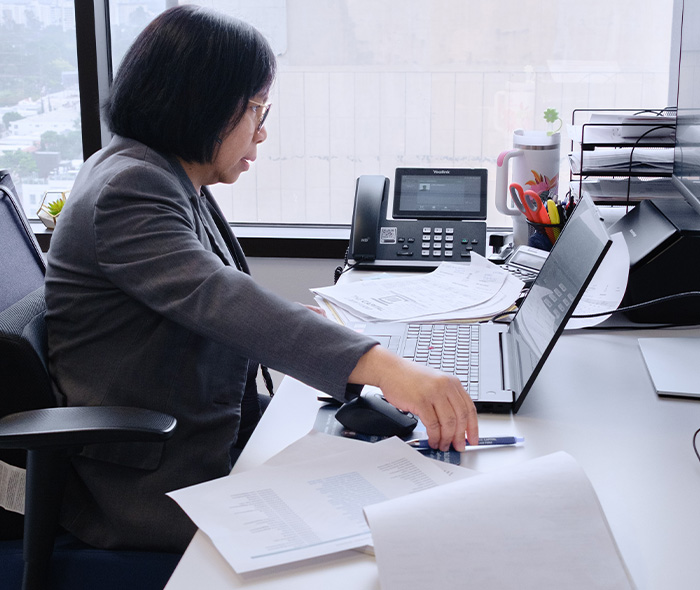 CAP_professional woman at desk in Long Beach